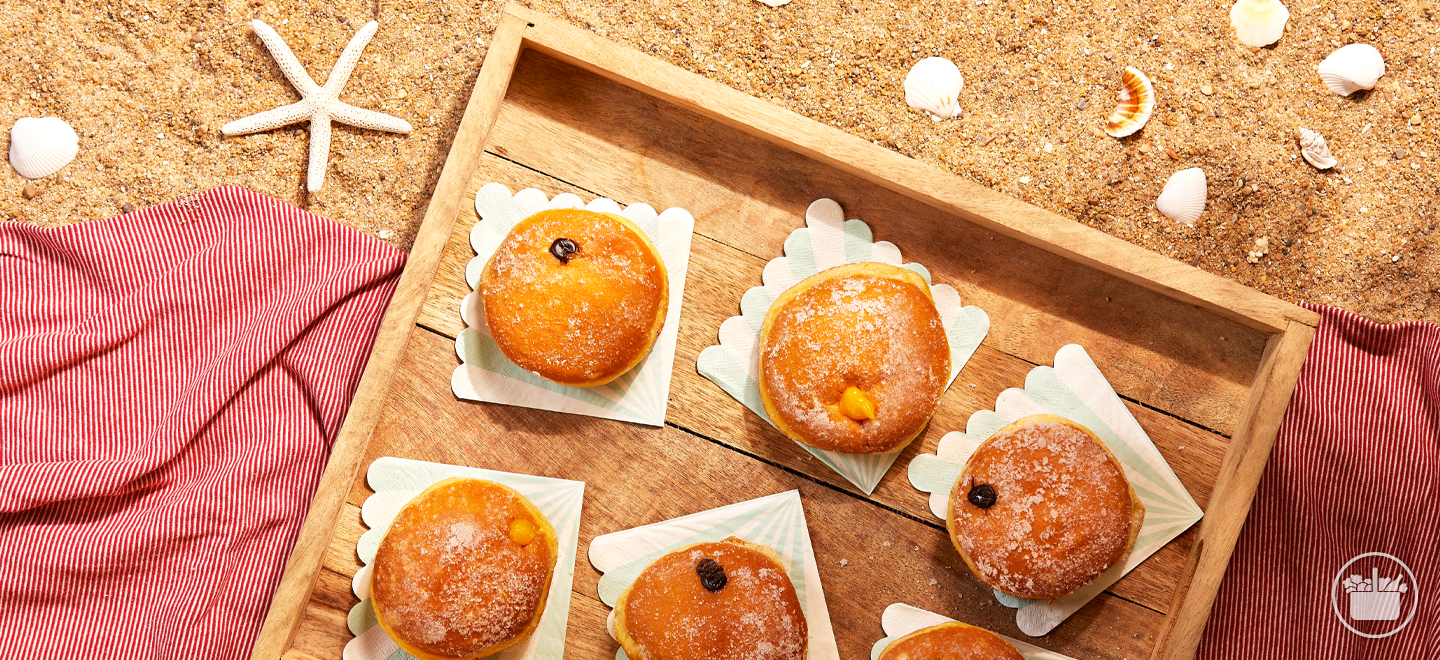 Descubra o sabor autêntico do verão com nossas Bolas de Berlim. A perfeição em cada mordida!